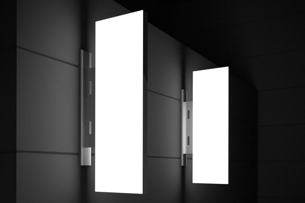illuminated vertical signs black wall